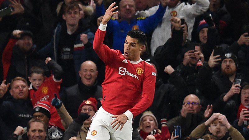 Fotografija: Cristiano Ronaldo proslavlja po zadetku v mreži Arsenala. FOTO: Oli Scarff/AFP
