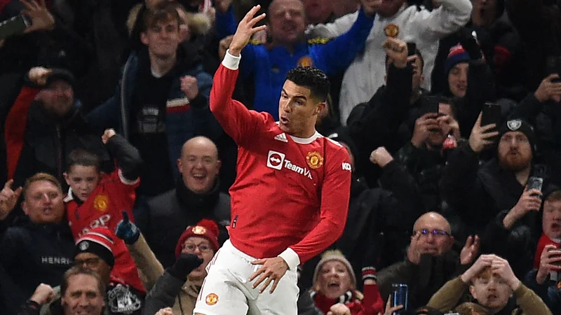 Fotografija: Cristiano Ronaldo proslavlja po zadetku v mreži Arsenala. FOTO: Oli Scarff/AFP