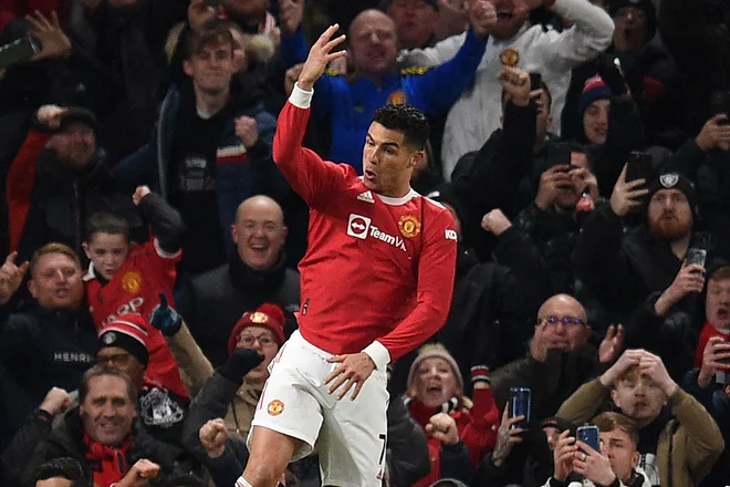 Cristiano Ronaldo proslavlja po zadetku v mreži Arsenala. FOTO: Oli Scarff/AFP

