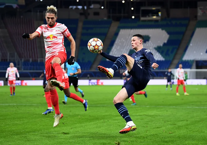 Kevin Kampl (levo), Slovenec pri Leipzigu, si je s soigralci priboril 3. mesto v skupini A lige prvakov in bo nadaljeval sezono v evropski ligi. FOTO: Annegret Hilse/Reuters
