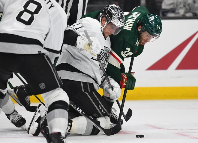 Anže Kopitar (v sredini) ni dosegel točke, toda LA Kings so le strli odpor Minnesote. FOTO: Jayne Kamin-oncea/Usa Today Sports
