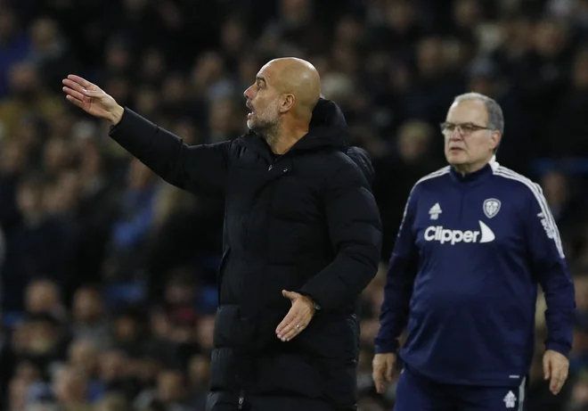 Josep Guardiola (levo) je pred prevzemom trenerskih poslov v Barceloni veliko časa preživel ravno z argentinskim posebnežem Marcelom Bielso (desno).&nbsp;FOTO: Phil Noble/Reuters
