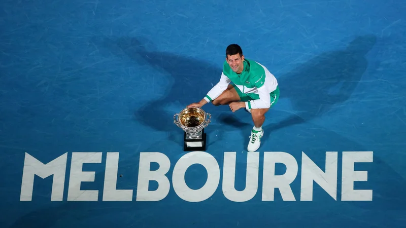 Fotografija: Novak Đoković še ni v Melbournu. FOTO: Kelly Defina/Reuters
