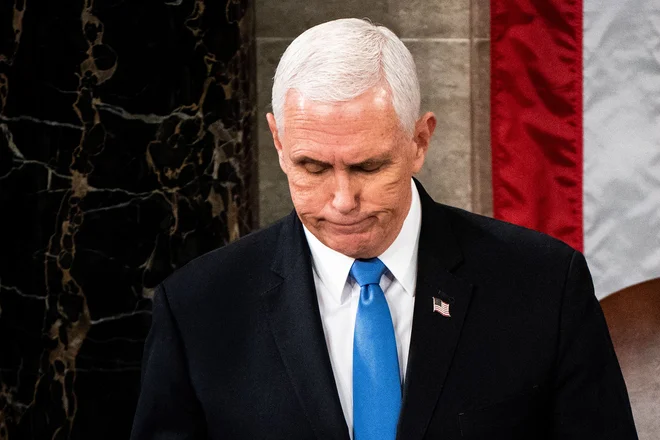 Nekdanji podpredsednik Mike Pence ni verjel, da bi lahko elektorske glasove vrnil zveznim državam. Foto Erin Schaff/Afp
