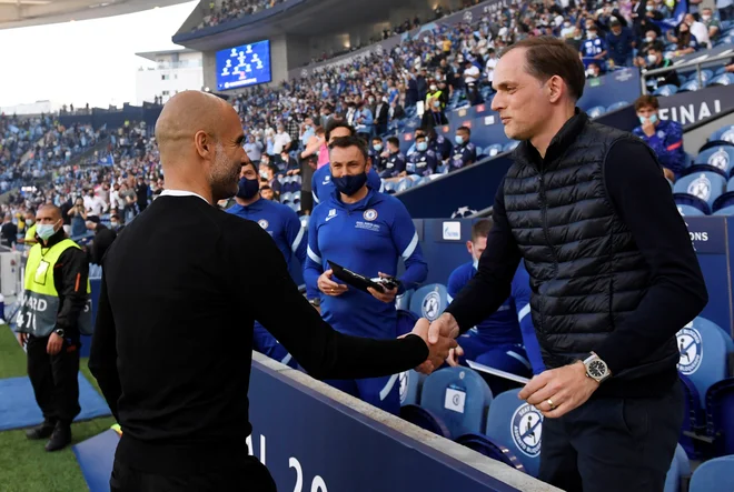 Chelsea Thomasa Tuchla (desno) in Man. City Josepa Guardiole (levo) sta se v Portu lani pomerila v velikem finalu lige prvakov, ki ga je z 1:0 dobil londonski klub. FOTO: Pierre-Philippe Marcou/Reuters
