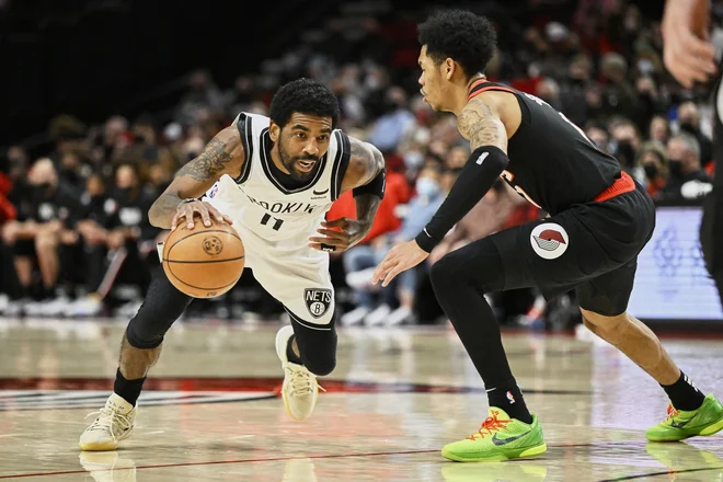 Kyrie Irving (11) je igral drugo tekmo v sezoni, a Brooklyn ni bil kos Portlandu. FOTO: Troy Wayrynen/Usa Today Sports
