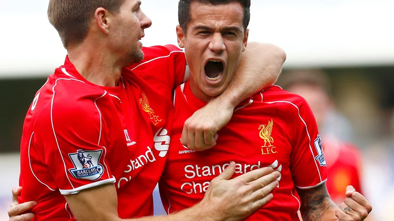 Fotografija: Philippe Coutinho (desno) in Steven Gerrard oktobra 2014 v majicah Liverpoola. FOTO: Eddie Keogh/Reuters
