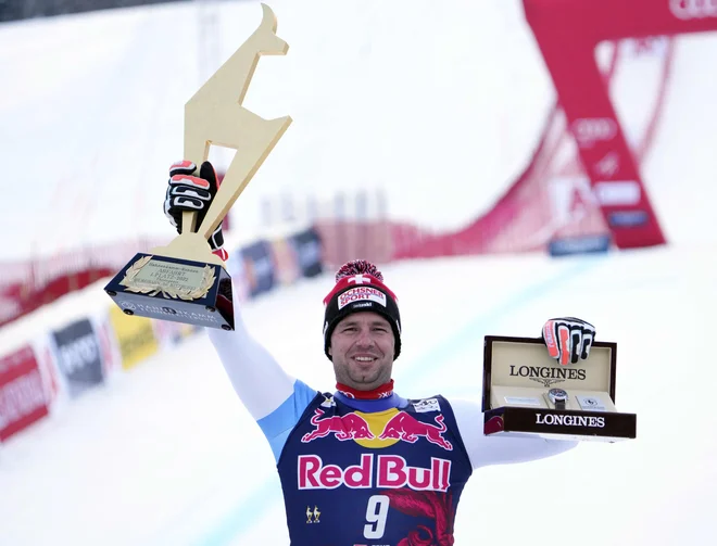 Beat Feuz je tretjič osvojil lovoriko za zmagovalca smuka v Kitzbühlu. FOTO: Georg Hochmuth/AFP
