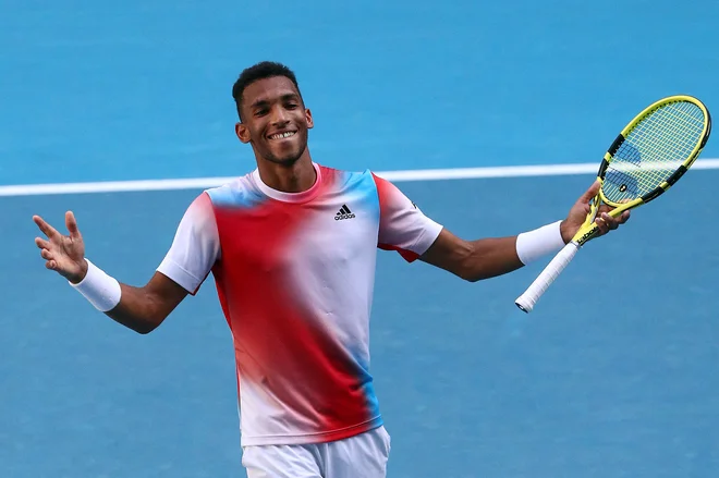Kanadčan Felix Auger-Aliassime je izločil Marina Čilića. FOTO: Aaron Francis/AFP
