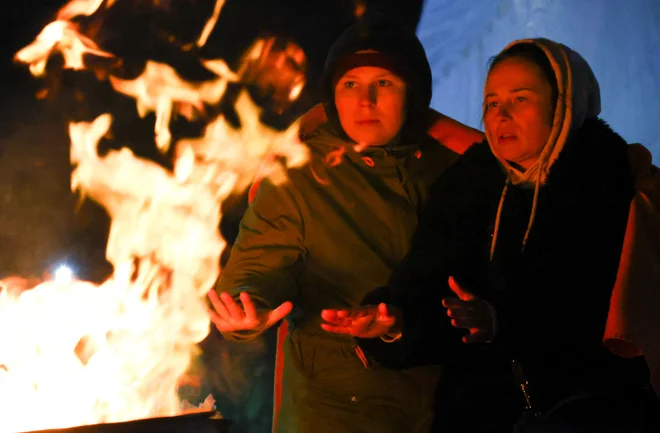 Na Poljsko je zbežalo že na tisoče ljudi. FOTO: Fabrizio Bensch/Reuters
