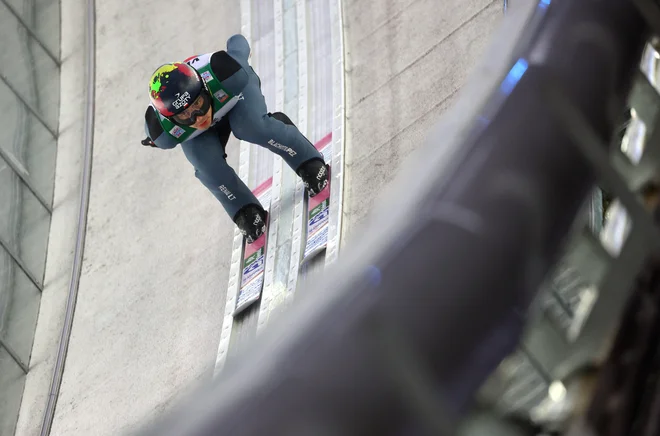 Jakub Wolny kot najboljši Poljak po prvem dnevu na svetovnem prvenstvu v Vikersundu drži 12. mesto. FOTO: Kai Pfaffenbach/Reuters
