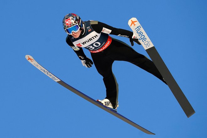 Marius Lindvik je novi svetovni prvak. FOTO: Terje Bendiksby/AFP

