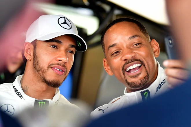 Lewis Hamilton in Will Smith sta prijatelja. FOTO: Andrej Isakovic/ AFP
