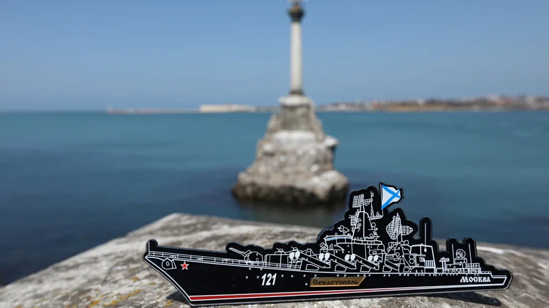 A magnet depicting the Russian missile cruiser Moskva, which sank in the Black Sea following a fire, is pictured at an embankment in Sevastopol, Crimea April 15, 2022. REUTERS/Alexey Pavlishak