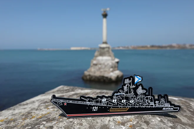 A magnet depicting the Russian missile cruiser Moskva, which sank in the Black Sea following a fire, is pictured at an embankment in Sevastopol, Crimea April 15, 2022. REUTERS/Alexey Pavlishak