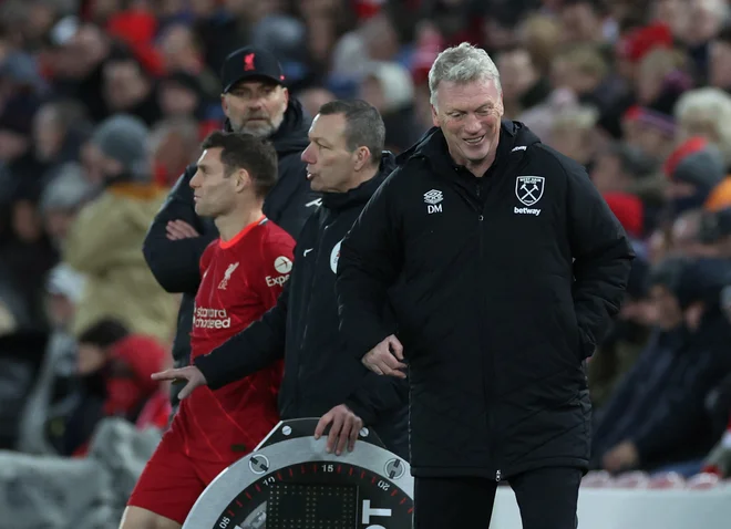 Zgolj Leicester in West Ham trenerja Davida Moyesa (desno) sta v tej ligaški sezoni premagala Liverpool, ki je v Londonu novembra klonil z 2:3. FOTO: Phil Noble/Reuters
