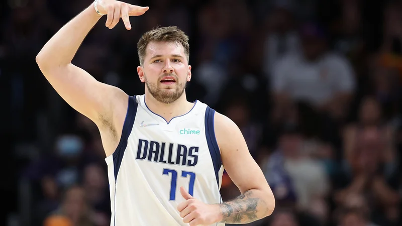 Fotografija: Luka Dončić po tekmi ni skrival navdušenja nad velikim podvigom v Phoenixu. FOTO: Christian Petersen/AFP