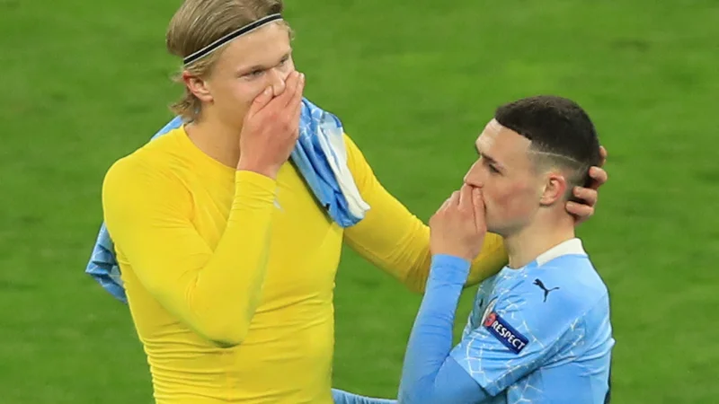 Fotografija: Erling Haaland in Phil Foden bosta odslej soigralca. FOTO: Wolfgang Rattay/AFP