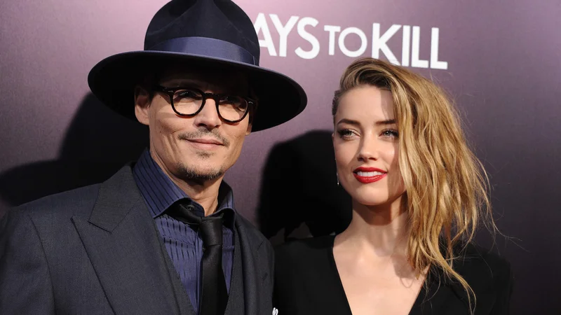 Fotografija: Johnny Depp in Amber Heard na fotografiji iz leta 2014. FOTO: Robyn Beck/AFP