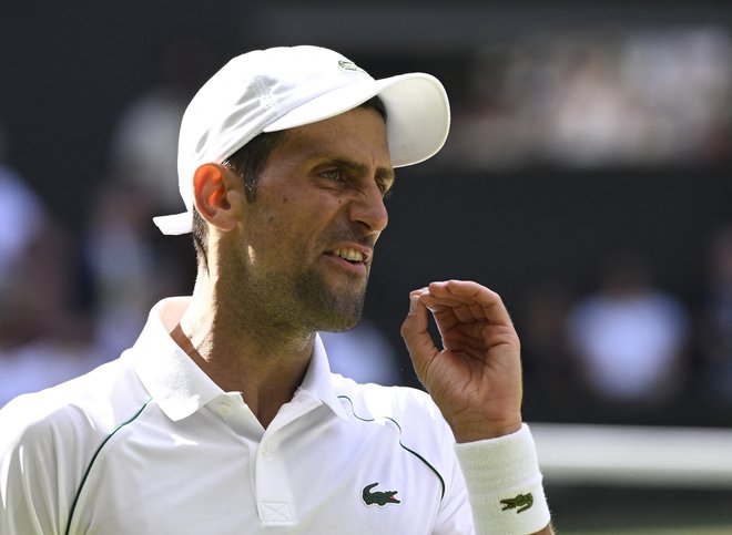 Novak Đoković je ubranil naslov v Wimbledonu. FOTO: Toby Melville/Reuters

