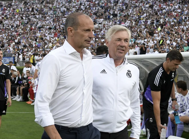 Trener Juventusa Max Allegi in Reala Carlo Ancelotti. FOTO: Kevork Djansezian/AFP
