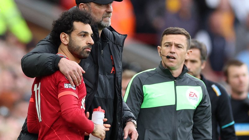 Fotografija: Mohamed Salah in trener Jürgen Klopp merita visoko tudi v tej sezoni. FOTO: Phil Noble/Reuters
