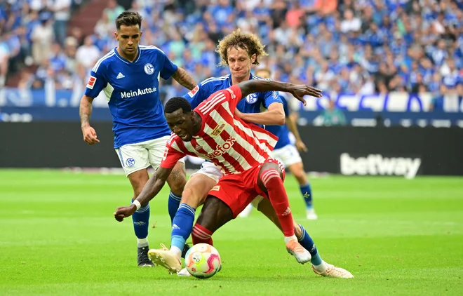 Tudi Surinamci znajo igrati nogomet, Sheraldo Becker (v sredini) je za berlinski Union dvakrat zadel proti Schalkeju. FOTO: Ina Fassbender/AFP
