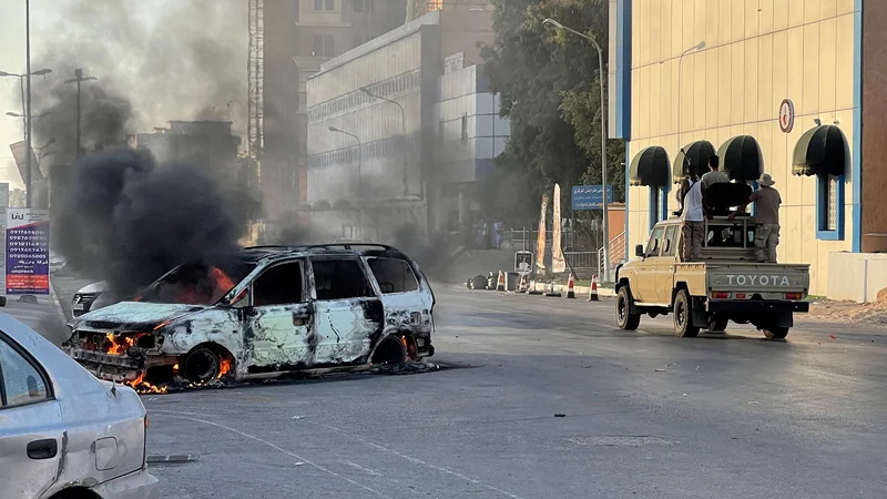 Med spopadi v Tripoliju je bilo ubitih 32 ljudi. FOTO: Mahmud Turkia/AFP