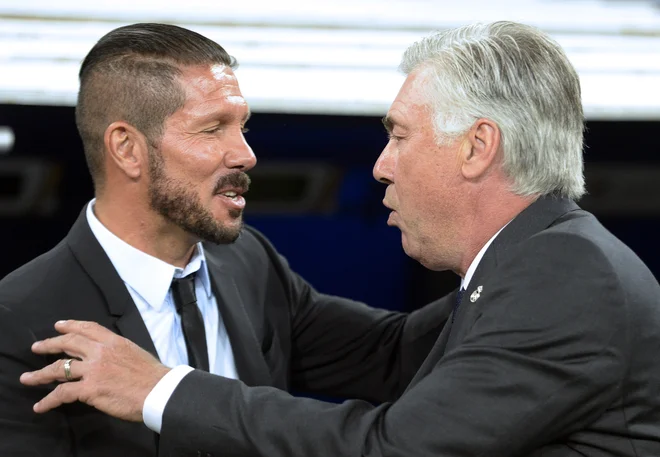 Diego Simeone in Carlo Ancelotti. FOTO: Gerard Julien/AFP
