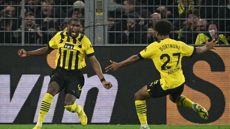 Anthony Modeste (levo) se je izjemno razveselil svojega gola za izenačenje v velikem derbiju bundeslige. FOTO: Ina Fassbender/AFP
