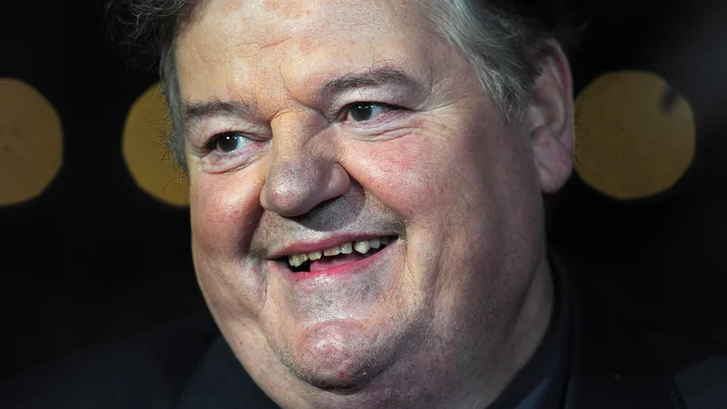 Fotografija: Robbie Coltrane si je z Michaelom Gambonom delil Guinnessov rekord za tri zaporedne nagrade bafta za najboljšega igralca za upodobitev Fitza v seriji Cracker. FOTO: Carl Court/AFP