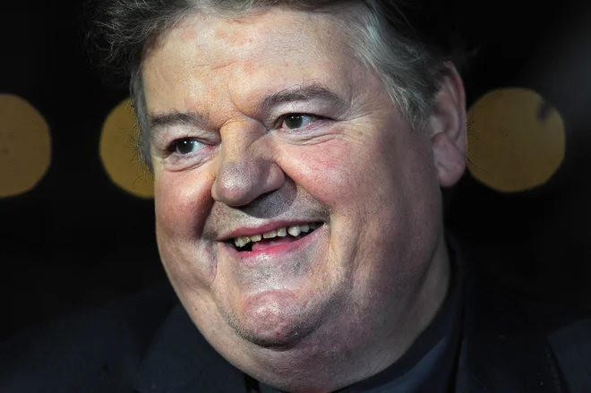 Robbie Coltrane si je z Michaelom Gambonom delil Guinnessov rekord za tri zaporedne nagrade bafta za najboljšega igralca za upodobitev Fitza v seriji Cracker.&nbsp;FOTO: Carl Court/AFP

