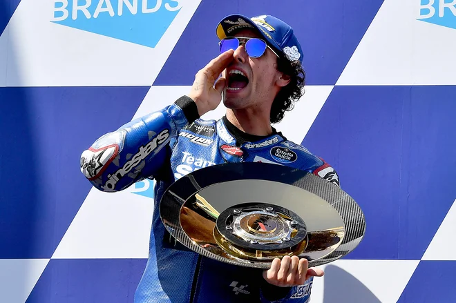 Alex Rins je kar vriskal od navdušenja. FOTO: Paul Crock/AFP
