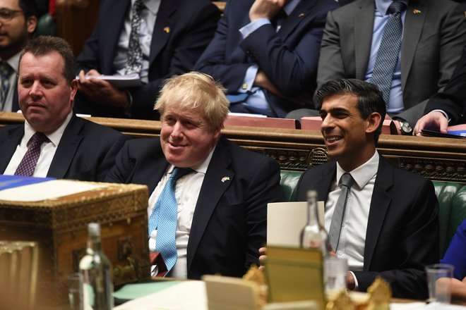 Boris Johnson in Rishi Sunak v času, ko sta skupaj sedela v vladi. Foto: Jessica Taylor/Reuters
