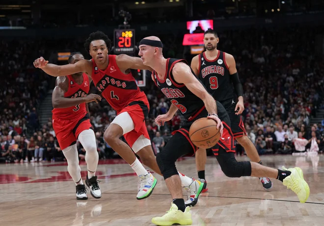 Alex Caruso in Scottie Barnes. FOTO: Nick Turchiaro/USA Today Sports
