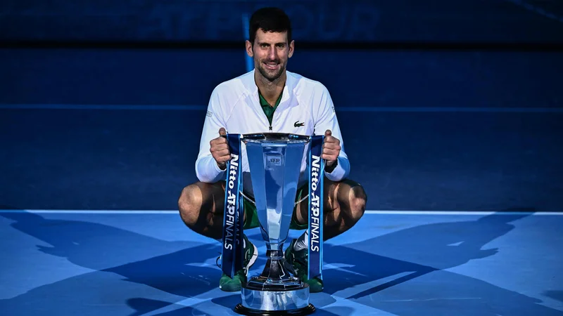 Fotografija: Novak Đoković se je od sezone poslovil z lovoriko in 4,5 milijona evrov nagrade.FOTO: Marco Bertorello/AFP
