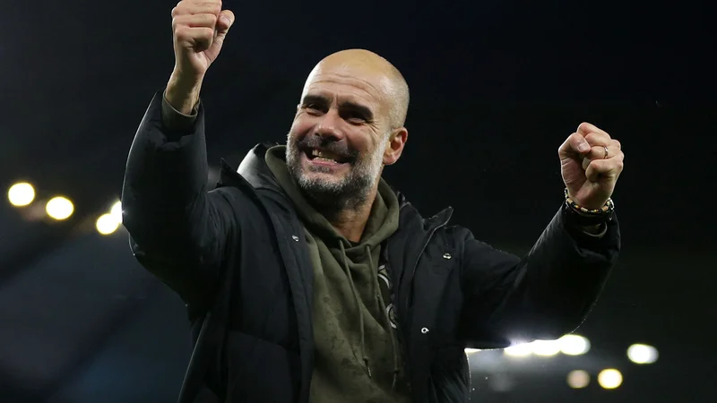 Fotografija: Slavje Pepa Guardiole po zmagi na novembrski ligaški tekmi s Fulhamom na domačem štadionu Etihad. FOTO: Adrian Dennis/AFP