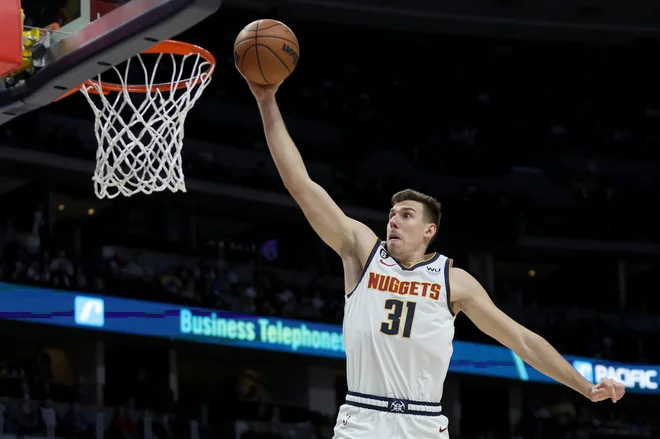 Vlatko Čančar odlično izkorišča svoje priložnosti in je vse bolj viden član Denverja, ki je v ligi NBA na drugem mestu zahodne konference. FOTO: Matthew Stockman/AFP
