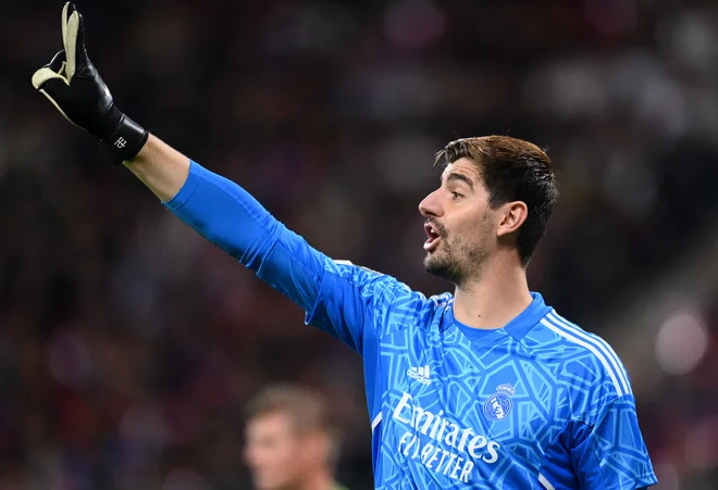 Thibaut Courtois je bil najboljši vratar v letu 2022. FOTO: Annegret Hilse/Reuters
