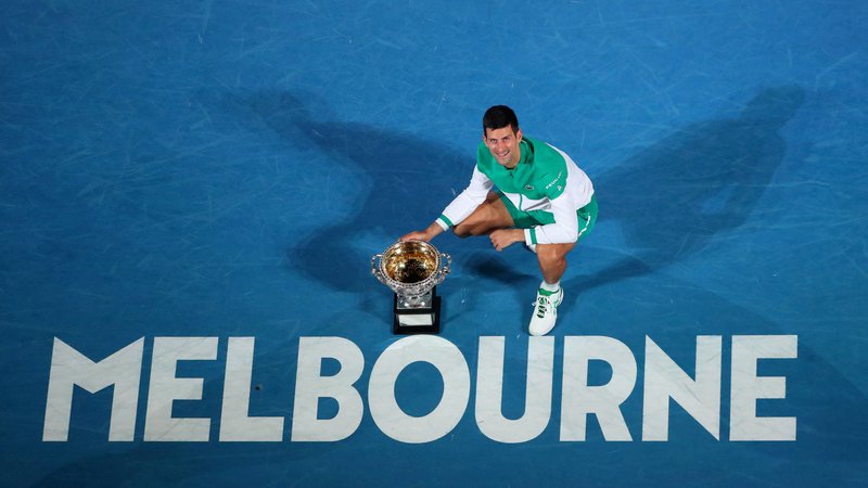 Fotografija: Novak Đoković že pet let ni izgubil na igriščih v Melbournu. FOTO: Kelly Defina/Reuters
