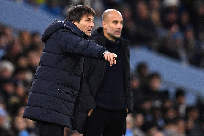 Trenerja Antonio Conte in Pep Guardiola FOTO: Oli Scarff/AFP
