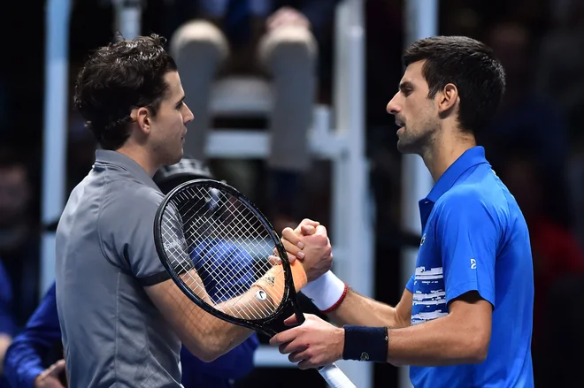 Novak Đoković in Dominic Thiem. FOTO: Glyn Kirk/AFP
