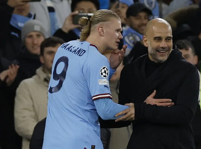 Erling Haaland in Pep Guardiola imeta pred sabo težko delo. FOTO: Jason Cairnduff/Reuters
