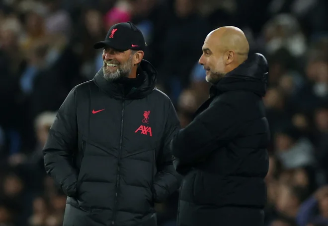 Pep Guardiola in Jürgen Klopp se bosta pomerila jutri. FOTO: Phil Noble/Reuters