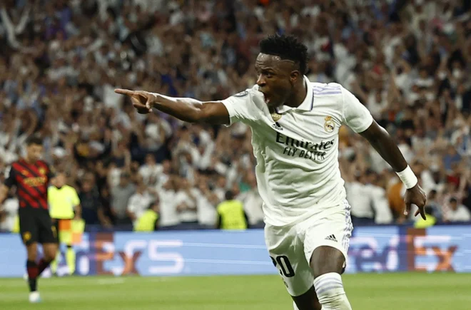 Takole se je Vinicius Junior veselil vodilnega gola na tekmi. FOTO: Juan Medina/Reuters
