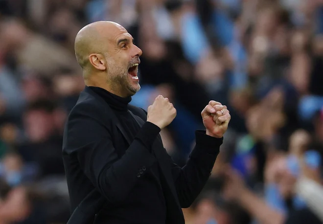 Pep Guardiola na trenerskem stolčku Manchester Cityja zbira lovorike. FOTO: Molly Darlington/Reuters