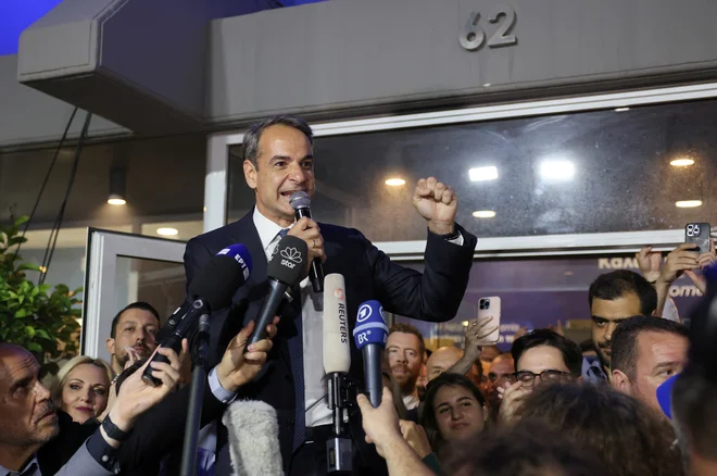 »Sprožili smo politični potres,« je dejal premier in vodja Nove demokracije Kiriakos Micotakis. Foto Stelios Misinas Reuters