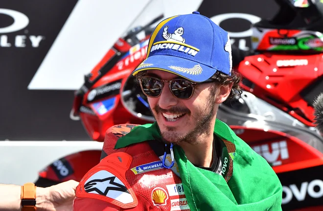 Francesco Bagnaia se je zelo razveselil zmage na domačih tleh. FOTO: Jennifer Lorenzini/Reuters
