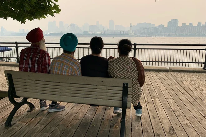Montreal's skyline is pictured from Jean Drapeau Park with smoke caused by the wildfires, in Montreal, Quebec, on June 25, 2023. Montreal had the worst air quality in the world according to IQ Air. Environment Canada issued a Smog warning because of the smoke and discouraged exercise and spending too long outdoors. Environment Canada also suggested the use of N95 face masks. The smoke is expected to pass by June 26, 2023 afternoon. (Photo by Anne-Sophie THILL / AFP)