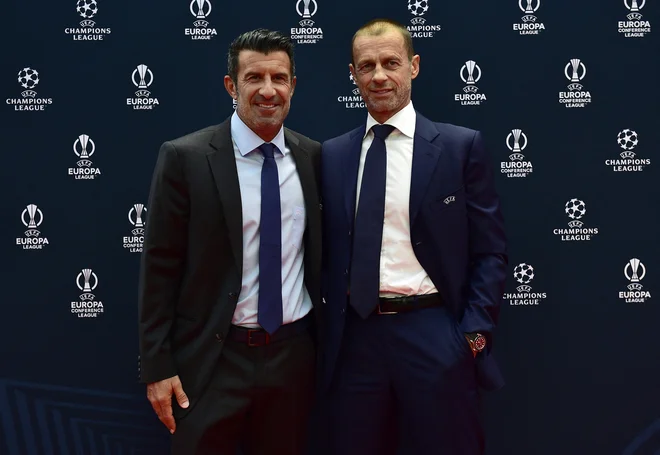 Na dobrodelni tekmi bo igral tudi Luis Figo, na fotografiji z Aleksandrom Čeferinom. FOTO: Reuters